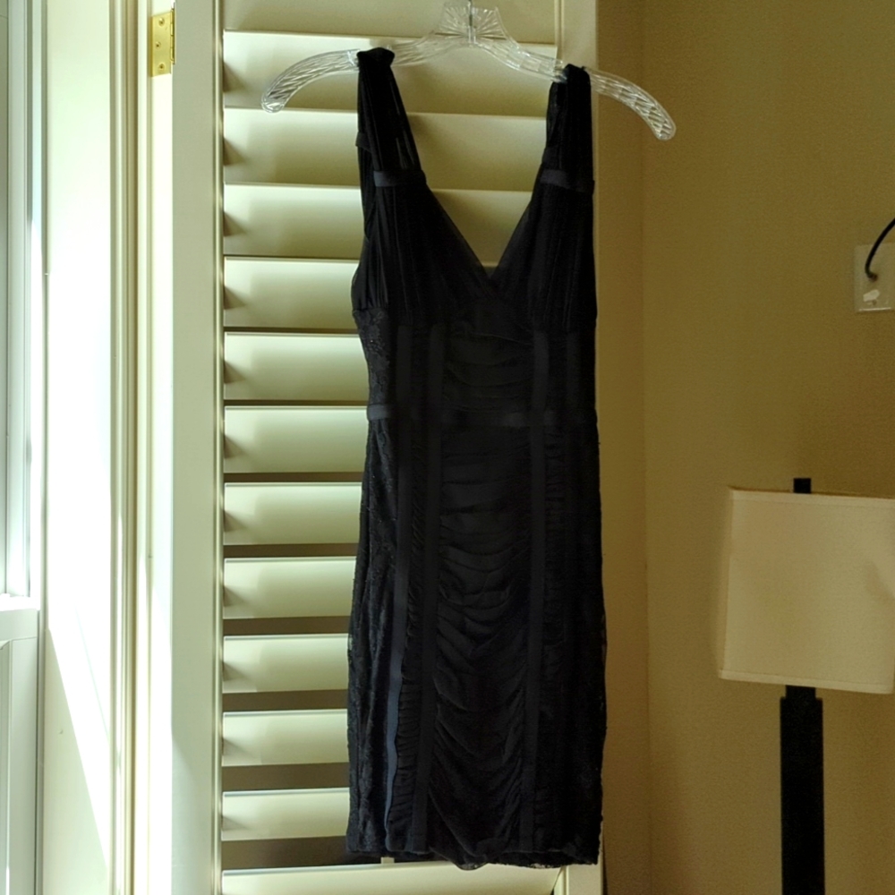 H&M size US 4 black sleeveless mini dress. Lace, ruching and sheer detail.